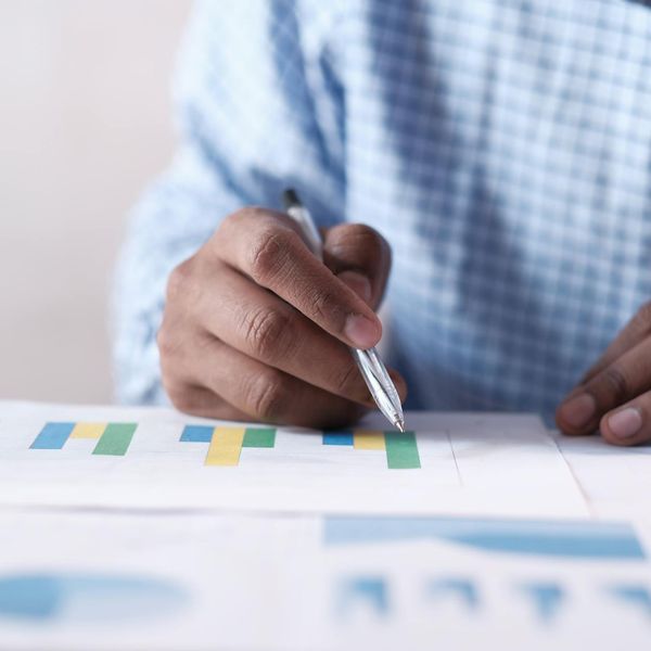 Business professional reviewing portfolio performance charts