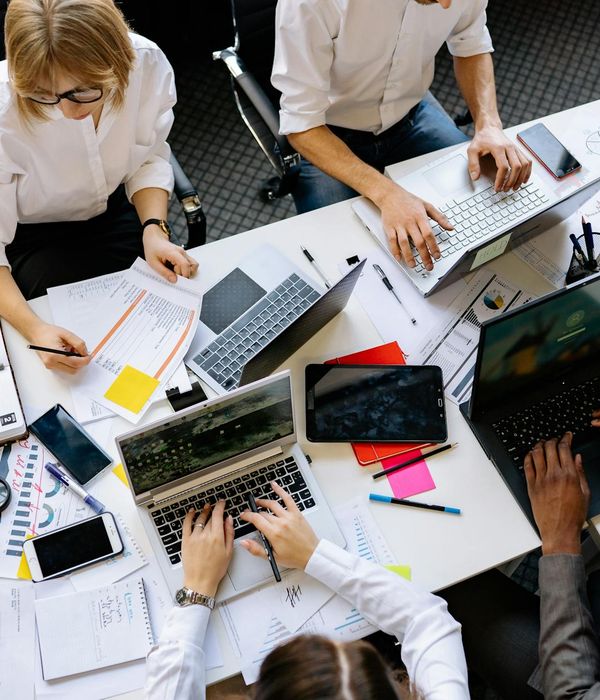 Business strategy planning session with investment charts and graphs